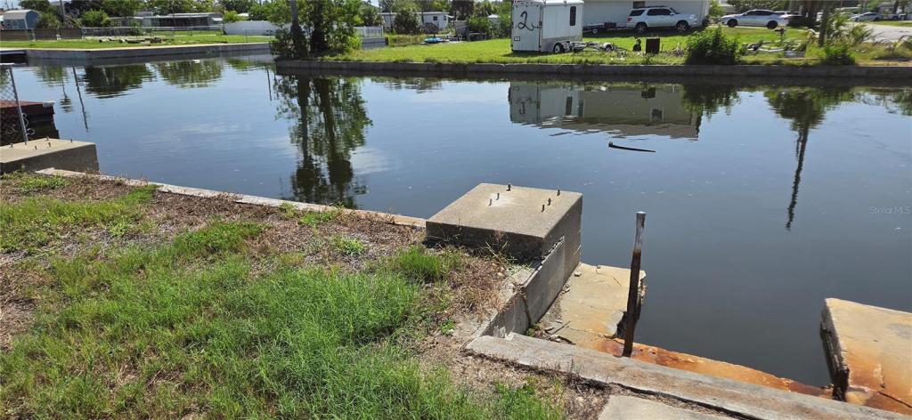 13320 Carol Drive, Hudson FL, Gulf access canal-front block home sold as-is after flooding