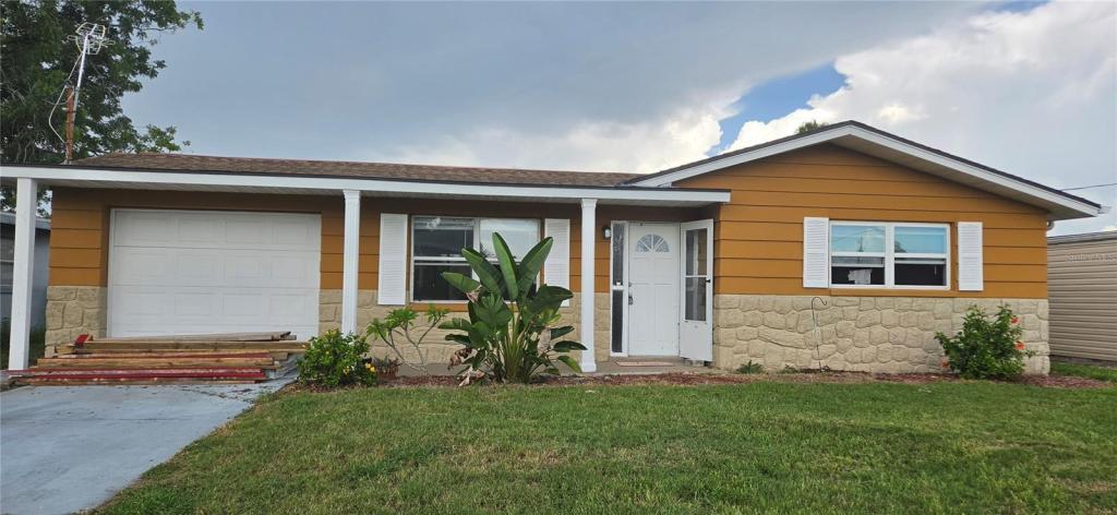 13324 Carol Drive, Hudson FL, Gulf access block home with attached garage, flood damaged, sold as-is